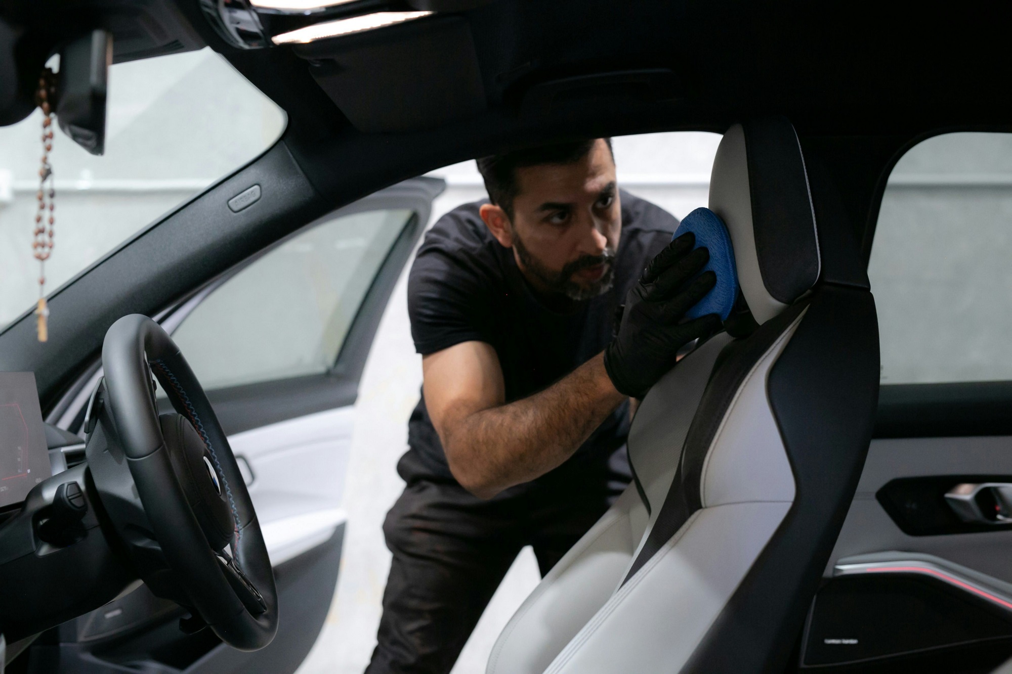 Person checking a car for damages